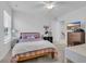 Well-lit bedroom with a queen bed, nightstand, and ample closet space at 299 Empyrean Circle, Myrtle Beach, SC 29588