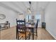 Dining room with wooden table, six chairs, and a wine cooler at 299 Empyrean Circle, Myrtle Beach, SC 29588