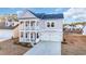 Two-story house with gray siding, white trim, and a two-car garage at 299 Empyrean Circle, Myrtle Beach, SC 29588