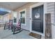 Front porch with rocking chairs and a welcoming sign at 299 Empyrean Circle, Myrtle Beach, SC 29588