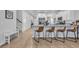 Modern kitchen features a large island with seating and stainless steel appliances at 299 Empyrean Circle, Myrtle Beach, SC 29588