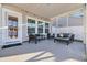 Enjoy the outdoors in this screened porch with comfortable seating at 299 Empyrean Circle, Myrtle Beach, SC 29588