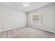 Bedroom with carpet, window and attic access at 4239 Villas Dr. # 609, Little River, SC 29566