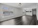 Spacious living room with hardwood floors and large windows at 4239 Villas Dr. # 609, Little River, SC 29566