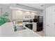 Well-equipped kitchen with white cabinets and black appliances at 4416 Eastport Blvd. # N15, Little River, SC 29566
