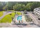 Community pool area featuring ample seating and poolside amenities surrounded by trees at 4518 N Plantation Harbour Dr. # G-1, Little River, SC 29566