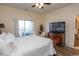 Second bedroom with comfortable bed and access to balcony at 4617 Lightkeepers Way # 9-I, Little River, SC 29566