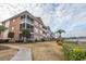 Exterior view of building showcasing landscaping and marina views at 4617 Lightkeepers Way # 9-I, Little River, SC 29566