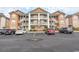Three-story building with ample parking and attractive facade at 4617 Lightkeepers Way # 9-I, Little River, SC 29566