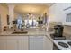 Open kitchen with granite countertops and a view to the living room at 4617 Lightkeepers Way # 9-I, Little River, SC 29566