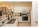 Kitchen with white cabinets, granite counters, and stainless steel appliances at 4617 Lightkeepers Way # 9-I, Little River, SC 29566
