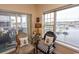 Relaxing living room area with water views from large windows at 4617 Lightkeepers Way # 9-I, Little River, SC 29566