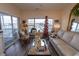 Bright living room with water views and comfortable seating at 4617 Lightkeepers Way # 9-I, Little River, SC 29566