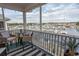 Enjoy water views from this screened balcony with charming seating area at 4617 Lightkeepers Way # 9-I, Little River, SC 29566