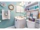 Small bathroom with toilet, vanity, and additional shelving at 4773 Wild Iris Dr. # 5-202, Myrtle Beach, SC 29577