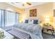 Spacious main bedroom with king-size bed, stylish decor, and ample natural light at 4773 Wild Iris Dr. # 5-202, Myrtle Beach, SC 29577