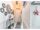 Bright entryway with coastal decor and mirrors at 4773 Wild Iris Dr. # 5-202, Myrtle Beach, SC 29577