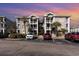 Brick building exterior with parking and landscaping at 4773 Wild Iris Dr. # 5-202, Myrtle Beach, SC 29577
