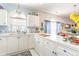 White kitchen with blue accents and ample counter space at 4773 Wild Iris Dr. # 5-202, Myrtle Beach, SC 29577