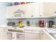 Well-equipped kitchen featuring white cabinets, stainless steel appliances, and ample counter space at 4773 Wild Iris Dr. # 5-202, Myrtle Beach, SC 29577
