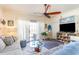 Living room with gray sectional sofa and access to balcony at 4773 Wild Iris Dr. # 5-202, Myrtle Beach, SC 29577