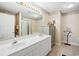 Bathroom featuring a double vanity, large mirror, and framed with seashell themed wall paper border at 489-3 Golden Bear Dr. # 3, Pawleys Island, SC 29585
