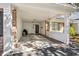 View of the home's carport featuring brick columns, a white ceiling, and access to a convenient storage area at 489-3 Golden Bear Dr. # 3, Pawleys Island, SC 29585