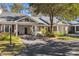 Charming home featuring a covered carport, manicured landscaping, and inviting curb appeal at 489-3 Golden Bear Dr. # 3, Pawleys Island, SC 29585