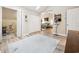 Hallway with neutral walls, leading to other rooms, and features skylight at 489-3 Golden Bear Dr. # 3, Pawleys Island, SC 29585