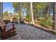 Outdoor patio with brick pavers, wooden bench and lush landscaping, perfect for relaxing at 489-3 Golden Bear Dr. # 3, Pawleys Island, SC 29585