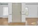 Light beige front door with keypad entry in hardwood floor entry at 502 Hay Hill Ln. # B, Myrtle Beach, SC 29579