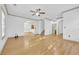 Bright living room with hardwood floors and a view of the kitchen and staircase at 502 Hay Hill Ln. # B, Myrtle Beach, SC 29579