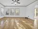 Spacious living room with hardwood floors and large windows at 502 Hay Hill Ln. # B, Myrtle Beach, SC 29579