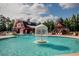 Community pool with water feature and lounge chairs at 502 Hay Hill Ln. # B, Myrtle Beach, SC 29579