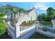 Home features a fenced backyard with a patio and palm trees at 5508 Whistling Duck Dr., North Myrtle Beach, SC 29582