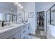 Elegant bathroom with double vanity, walk-in shower, and linen closet at 5508 Whistling Duck Dr., North Myrtle Beach, SC 29582