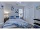 Bedroom with a double bed, plenty of closet space, and soft blue decor at 5508 Whistling Duck Dr., North Myrtle Beach, SC 29582