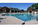 Large community pool with a clubhouse and lounge chairs at 5508 Whistling Duck Dr., North Myrtle Beach, SC 29582