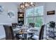 Elegant dining room with glass-top table and comfortable seating for four at 5508 Whistling Duck Dr., North Myrtle Beach, SC 29582