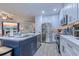 Modern kitchen with stainless steel appliances and a large island with seating at 5508 Whistling Duck Dr., North Myrtle Beach, SC 29582