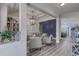 Open concept living space with seating area and view into adjacent kitchen at 5508 Whistling Duck Dr., North Myrtle Beach, SC 29582