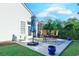 Relaxing patio with seating area, umbrella, and planters at 5508 Whistling Duck Dr., North Myrtle Beach, SC 29582