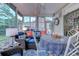 Relaxing sunroom featuring comfortable seating and a view of the backyard at 5508 Whistling Duck Dr., North Myrtle Beach, SC 29582