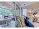 Bright sunroom with seating area, table, and access to the outdoors at 5508 Whistling Duck Dr., North Myrtle Beach, SC 29582