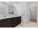 Double vanity bathroom with a large mirror and an adjacent closet at 5525 Plantersville Pl., Myrtle Beach, SC 29579