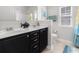 Double sink bathroom with dark brown vanity and tile flooring at 5525 Plantersville Pl., Myrtle Beach, SC 29579