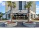The Renaissance Towers building exterior with palm trees at 5905 South Kings Hwy. # 408, Myrtle Beach, SC 29575