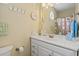Clean bathroom with white vanity and geometric shower curtain at 6001 - 1243 S Kings Hwy., Myrtle Beach, SC 29575