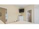 Bedroom with dresser, TV, and access to a full bathroom at 6001 - 1243 S Kings Hwy., Myrtle Beach, SC 29575