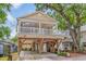 Two-story elevated beach house with wrap-around deck and spacious parking underneath at 6001 - 1243 S Kings Hwy., Myrtle Beach, SC 29575